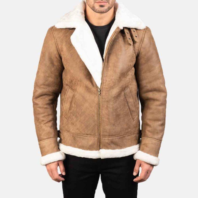 1. Front View: Rugged Canyon Ridge Leather Bomber Jacket with buckled collar and zipper closure. 2. Side View: Stylish brown bomber jacket showcasing roll-back cuffs and waist adjustment straps. 3. Back View: Distressed brown leather jacket with smooth finish and faux fur lining.